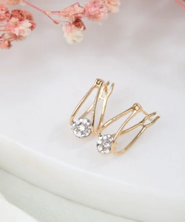 A pair of gold with diamond earrings