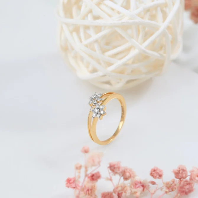 a gold ring with diamonds and a white ball of straw